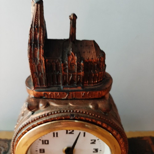 Copper German wind-up clock used with cathedral motif