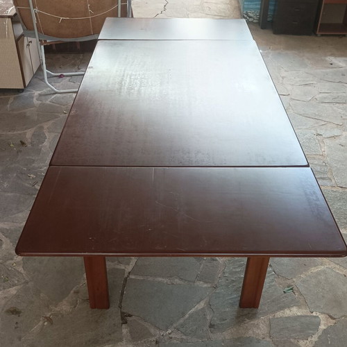 Wooden dining table used with extension