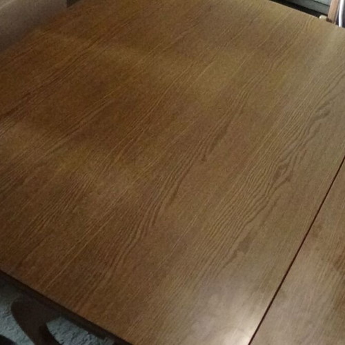 Wooden dining table used with extension