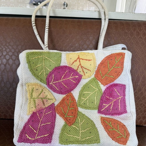 Knitted shoulder bag with colorful leaf designs like new