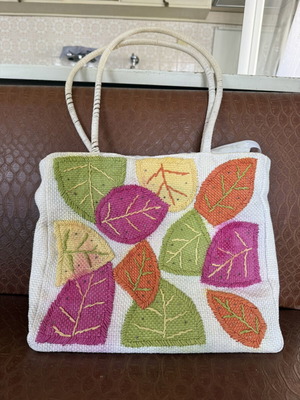Knitted shoulder bag with colorful leaf designs like new