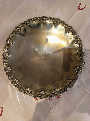 Vintage metal serving tray 29 cm used with embossed flowers and feet