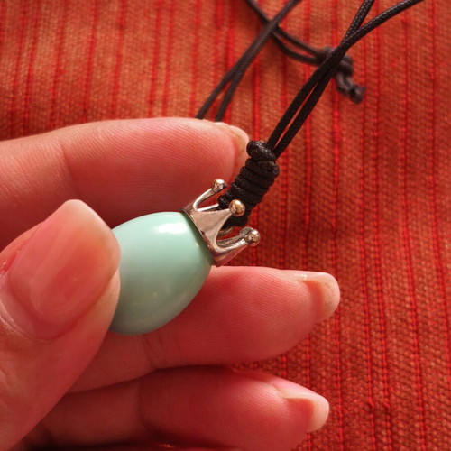 Handmade necklace with crown pendant and teardrop stone, used