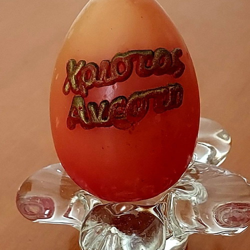 Easter decorative egg-shaped candle like new with glass base