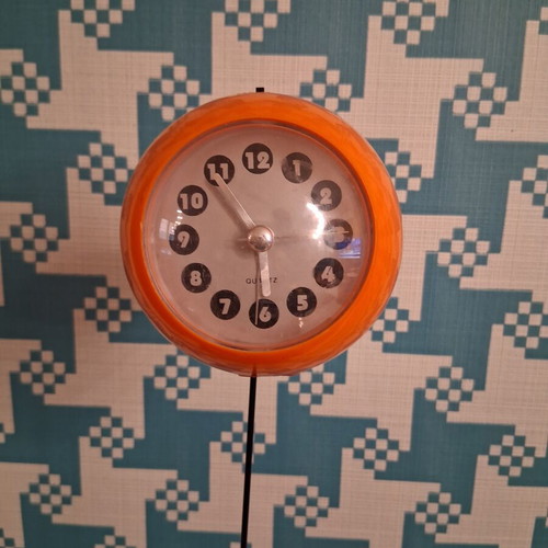 Quartz space age table clock 1970s, orange with black base