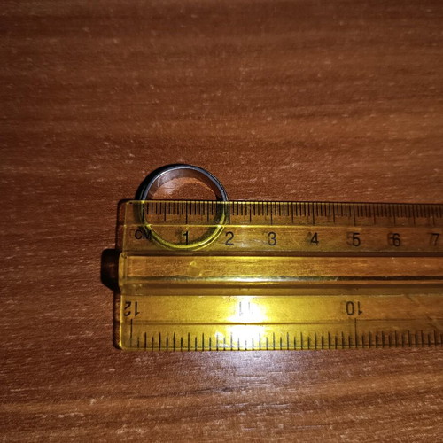 Steel ring used, silver with wear on design color