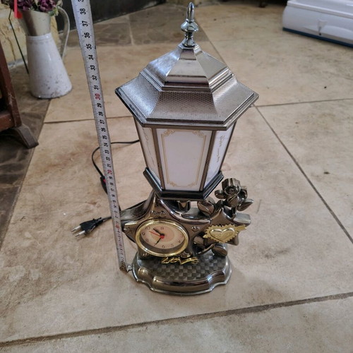 Plastic vintage table lamp with clock used