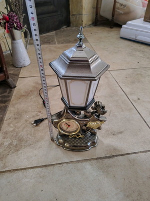 Plastic vintage table lamp with clock used