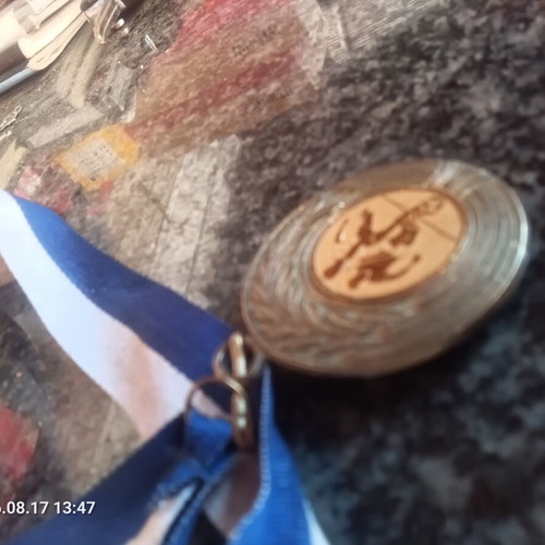 Football collectible medal with gold details