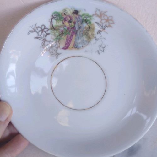 Porcelain vintage plates used, set of two with gold details