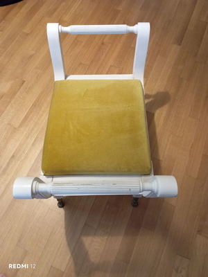 Stool used, missing two legs