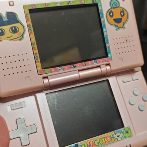 Nintendo DS used, pink with Tamagotchi stickers