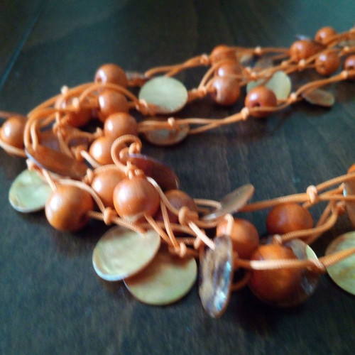 Alternative summer necklace used with wooden beads and orange mother of pearl