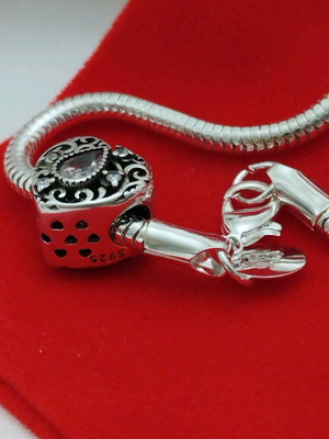 Silver bracelet made to order with three different charms