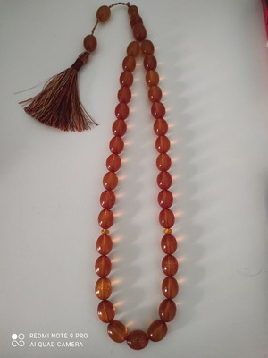 Mastic komboloi with orange shades, 33 beads
