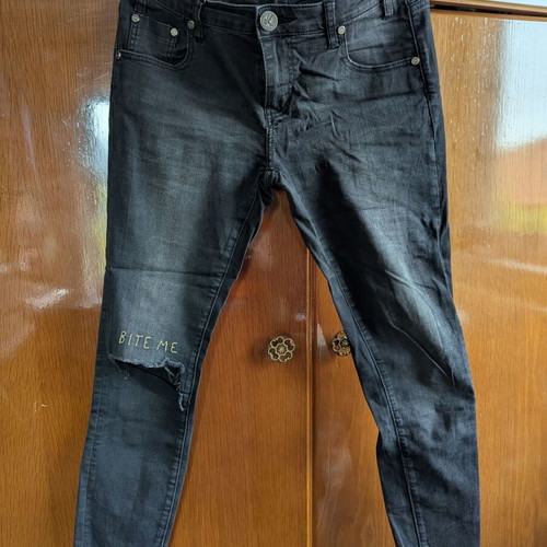 One Teaspoon Jeans size 28 like new, black with knee rip and 'bite me'