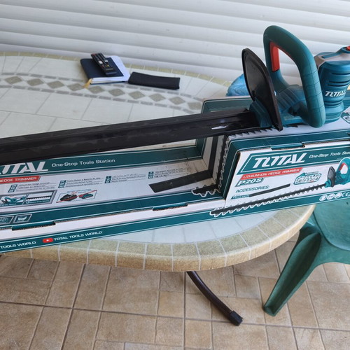 Total cordless hedge trimmer with battery and charger