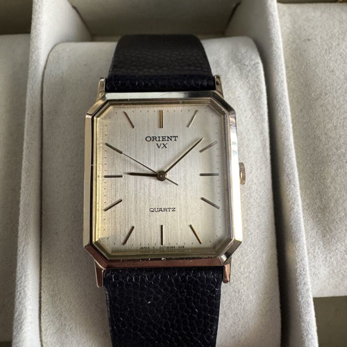 Orient VX Quartz watch, vintage gold rectangular case, brown leather strap