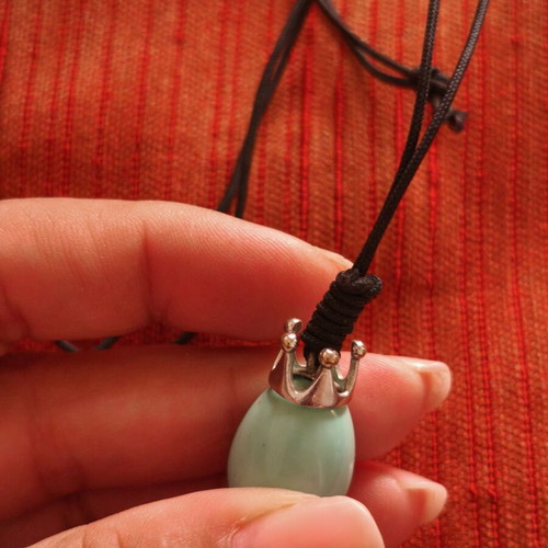 Handmade necklace with crown pendant and teardrop stone, used
