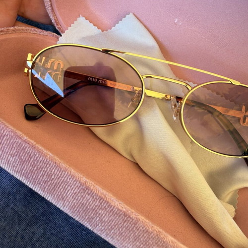 Miu Miu SMU 54ZS ZVN-70D sunglasses like new, gold frame, pink lenses