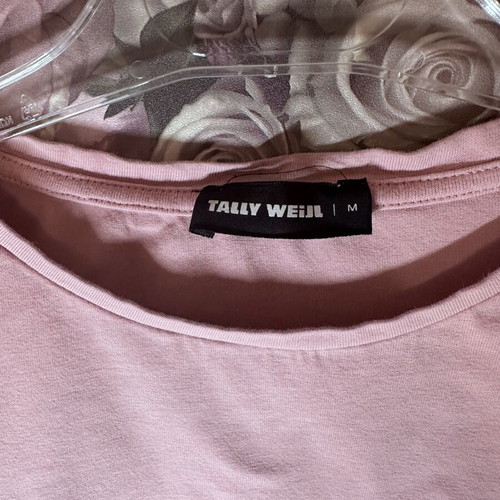 Pink short-sleeve crop top with black elastic band, size M