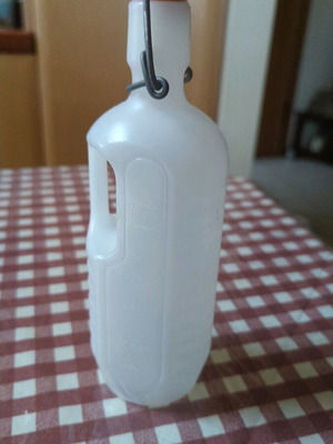 Plastic bottle with safety cap unused