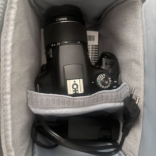 Canon EOS 2000D camera with case and tripod