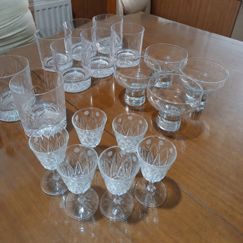 Set of 17 crystal glasses and bowls with carved details