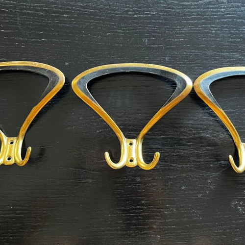 3 gold metal wall hooks