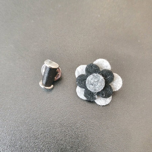 Set of two men's lapel pins like new, black and silver