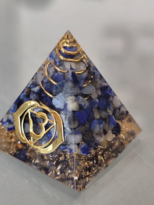 Orgonite energy pyramid with lapis lazuli stones, Ajna chakra symbol