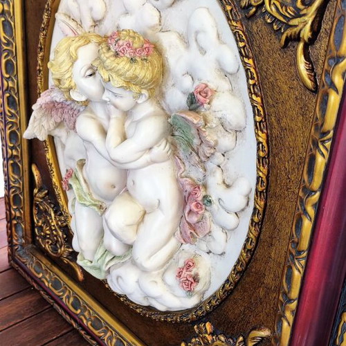 Relief wall art used in ornate frame 56x50cm