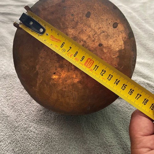Handmade copper cauldron used with hammered texture and designs