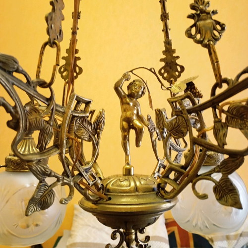 Solid brass chandelier used with crystals and putto figurine