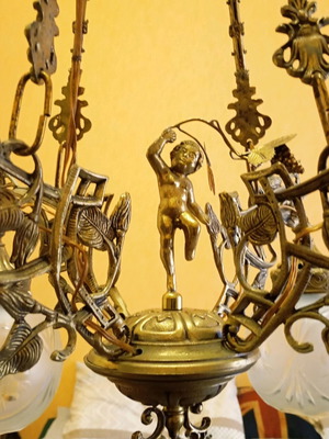 Solid brass chandelier used with crystals and putto figurine