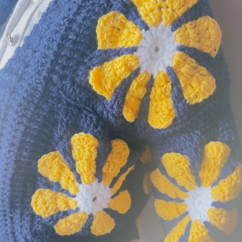 Handmade crochet cardigan made to order with daisies in blue and yellow