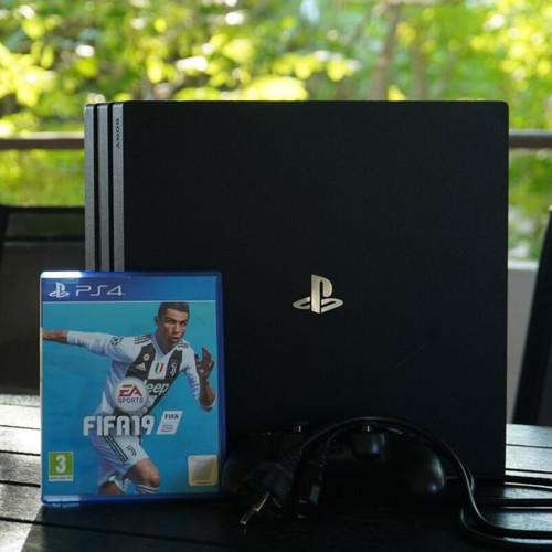 PS4 Pro 1TB console with FIFA 19 game, power cable and controller