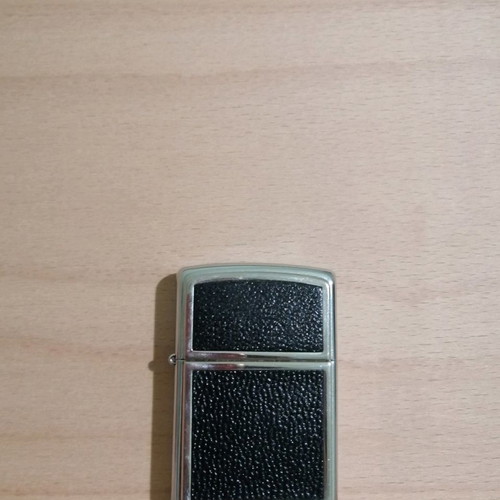 Zippo lighter used with appliqué leather decoration