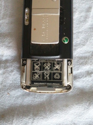 Sony Ericsson mobile phone used, missing back cover