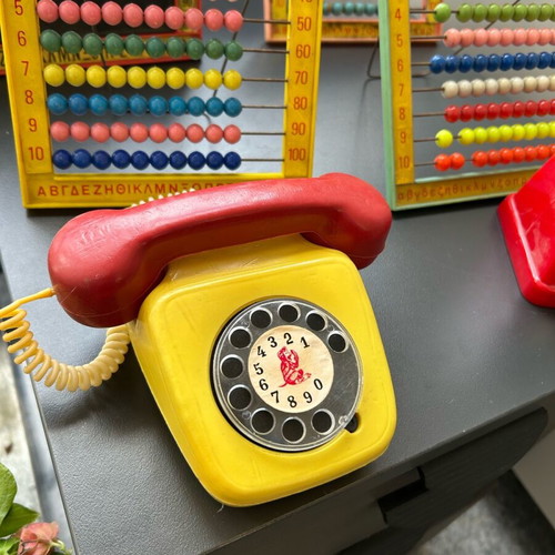 Vintage toys used, 1970s abacus counters, plastic phone