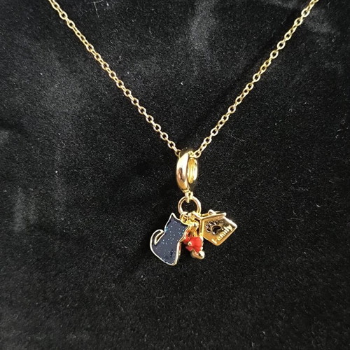 Gold Tone Necklace with Cat, House, and Red Bow Charms