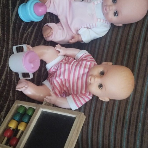 Baby dolls with extra toys, pack of 2
