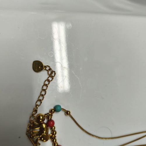 Two stainless steel necklaces like new, red and gold