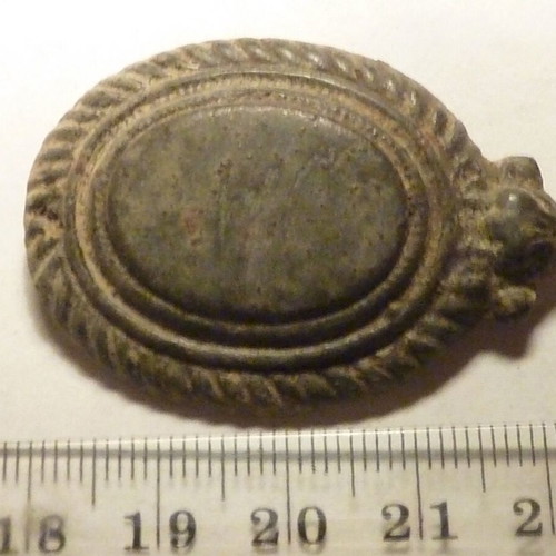 Antique bronze applique from horse harness used