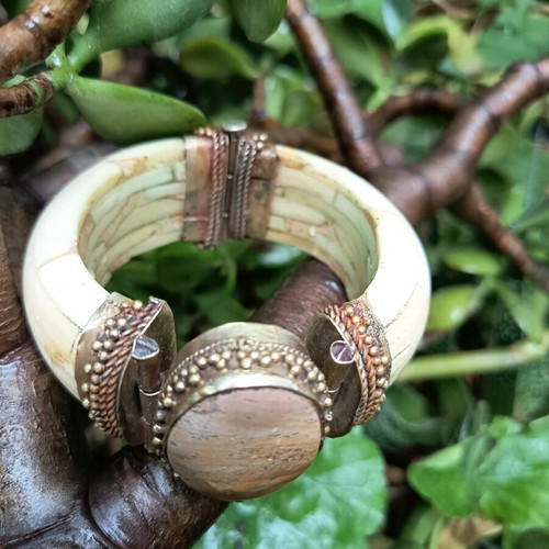 Boho bracelet used with bronze details beige