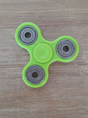 Fidget spinner used, metal with wear