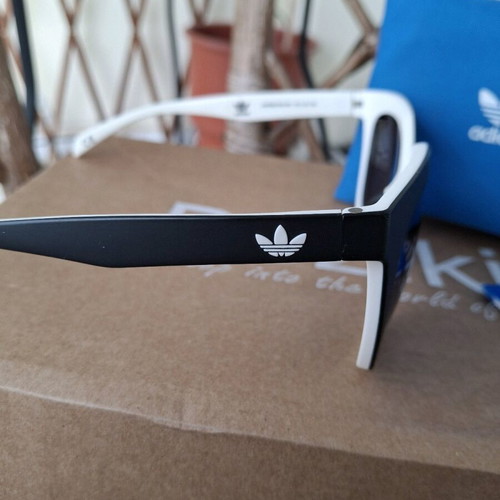 Adidas sunglasses used, black matte with blue mirror lens