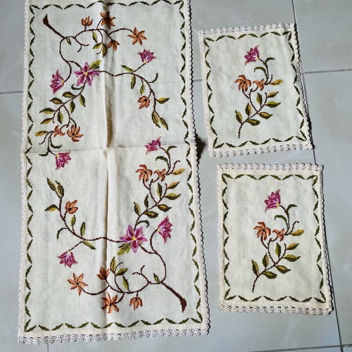 Set of handmade embroidered table linens used