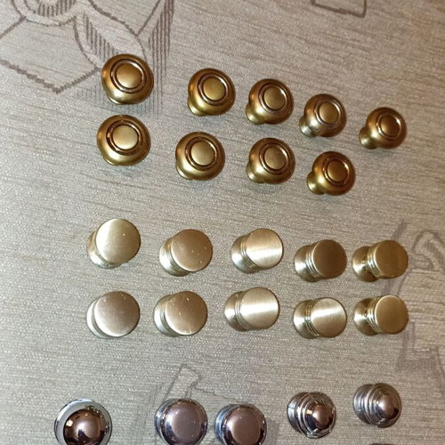 Handles and knobs for cabinets and drawers used, 24 pieces gold and silver