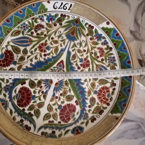 Ceramic wall plate used with gold details